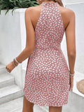 Back view of pink halter mini dress with curved wrap-inspired skirt