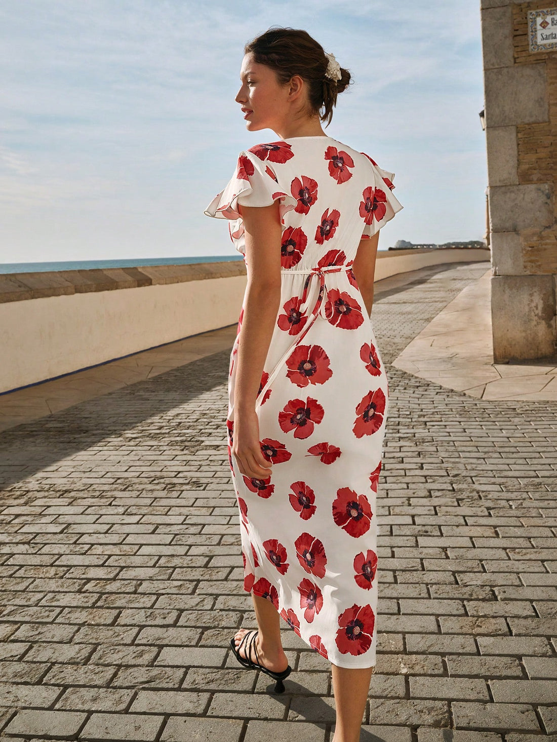 Experience the best of spring and summer with our Chic Floral V-Neck Dress. With its ruffled sleeves and elegant floral design, you'll effortlessly stand out in any occasion. Whether it's a garden party or a day out, this dress is perfect for adding a touch of whimsy and charm to your look.