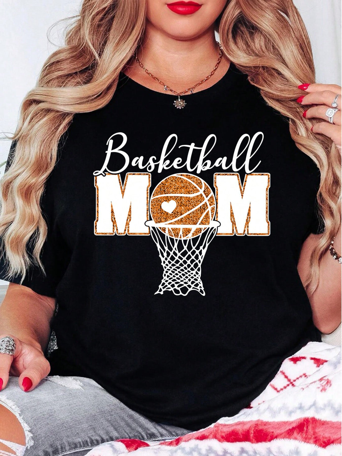 Get ready to cheer on your favorite baller with this Retro Glitter Basketball Mom Oversized Shirt! Perfect for holiday gatherings and gifting, this stylish and quirky shirt will make you the envy of the bleachers. Boldly show off your mom pride in this fun and playful shirt. (Dribble not included.)