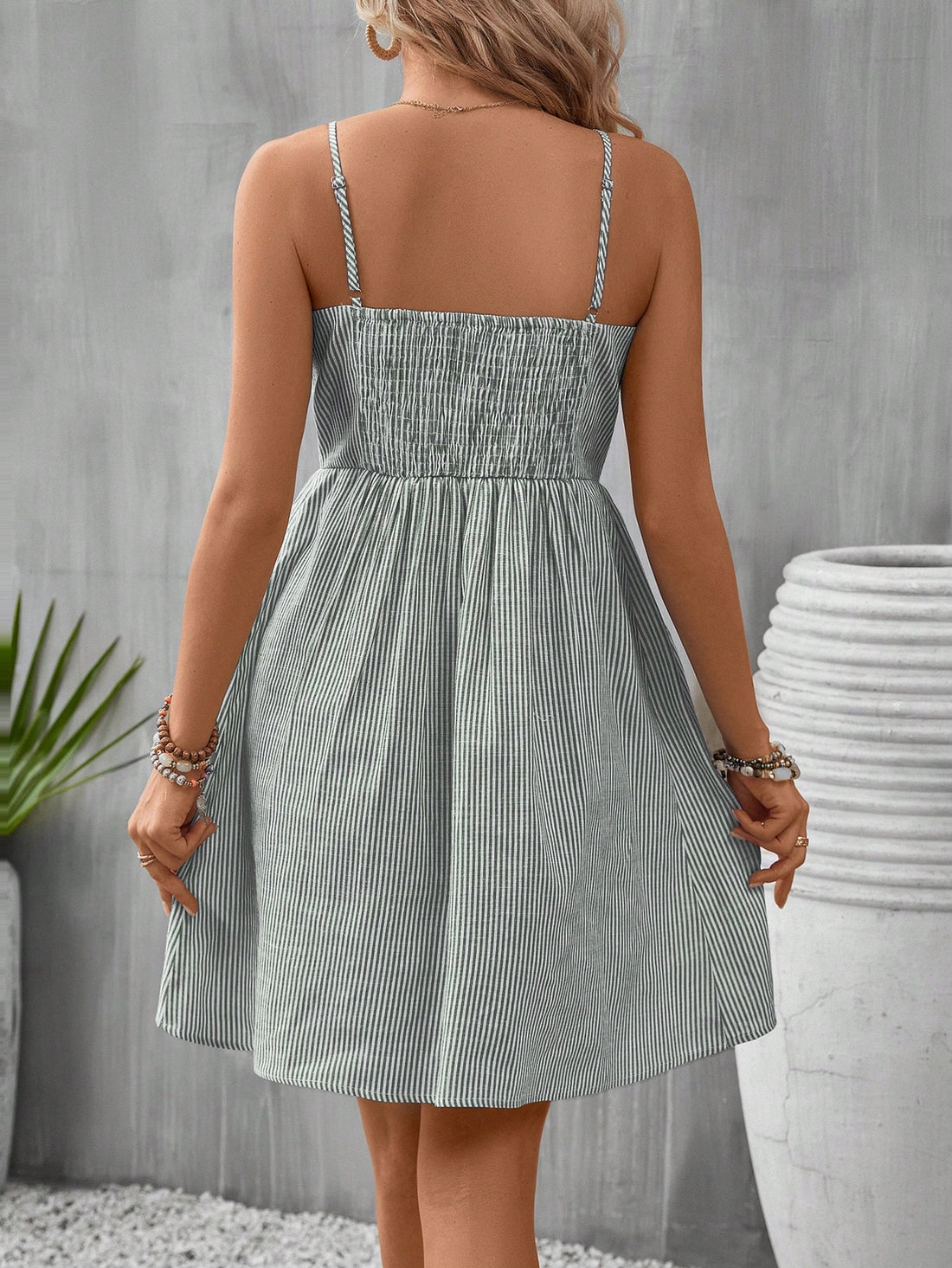 Look effortlessly chic in this playful striped mini dress with a button front and convenient pockets. Perfect for both casual and dressy occasions, this dress promises to keep you stylish and comfortable all day long. Who said fashion had to be difficult? (Hint: not us!)