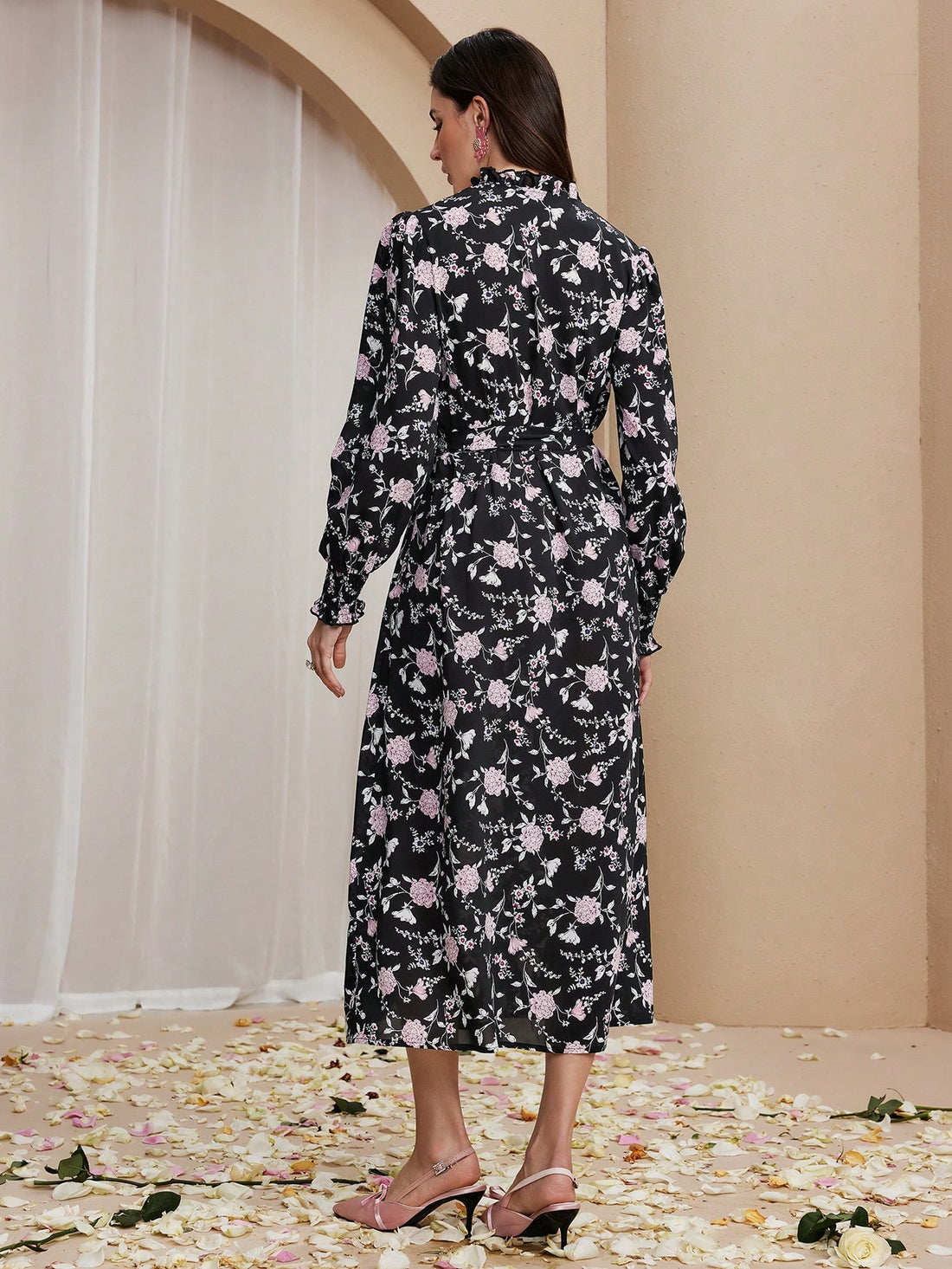 Unleash your inner flower power with this stylish black dress. Perfect for any occasion, its timeless design will have you turning heads and feeling confident. (Flower crown and peace sign not included.)