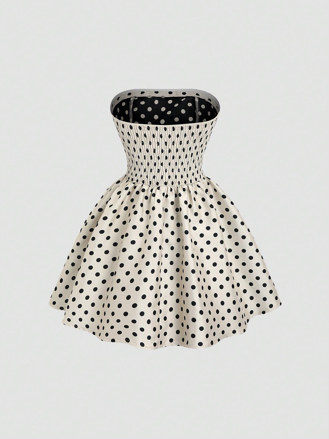 Step out in style with this chic French vintage-inspired mini dress. Featuring a playful polka dot pattern and a trendy tube top design, it perfectly highlights your shoulders. The slimming waist detail flatters your figure, making it ideal for fun days or lively nights. Embrace a flirty, timeless look that’s sure to turn heads wherever you go!
