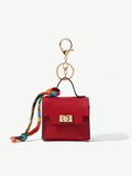 Close-up view of mini key ring holder keychain coin purse earphone pouch bag charm with chain strap, coin purse format, key ring detail for small-item storage