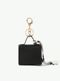 Back view of mini key ring holder keychain coin purse earphone pouch bag charm with chain strap, coin purse format, key ring detail for small-item storage