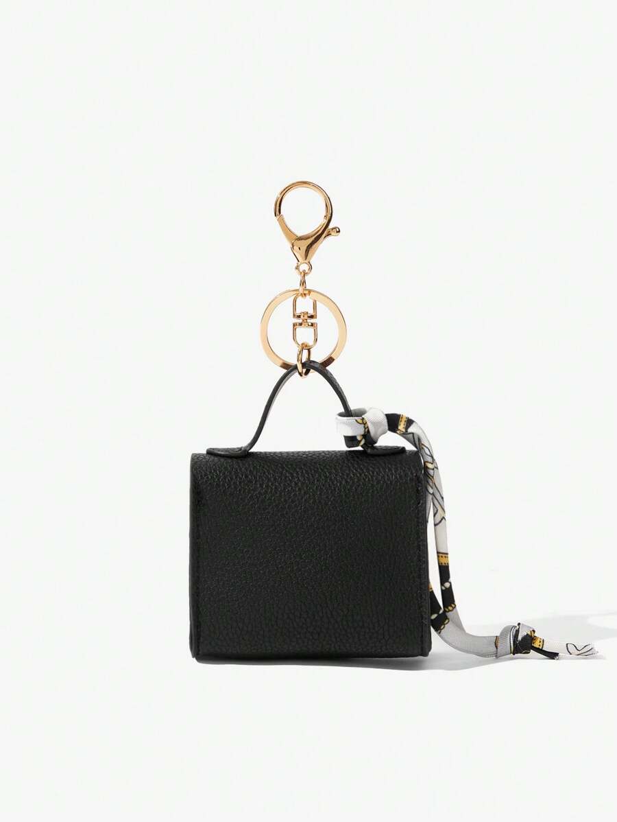 Back view of mini key ring holder keychain coin purse earphone pouch bag charm with chain strap, coin purse format, key ring detail for small-item storage