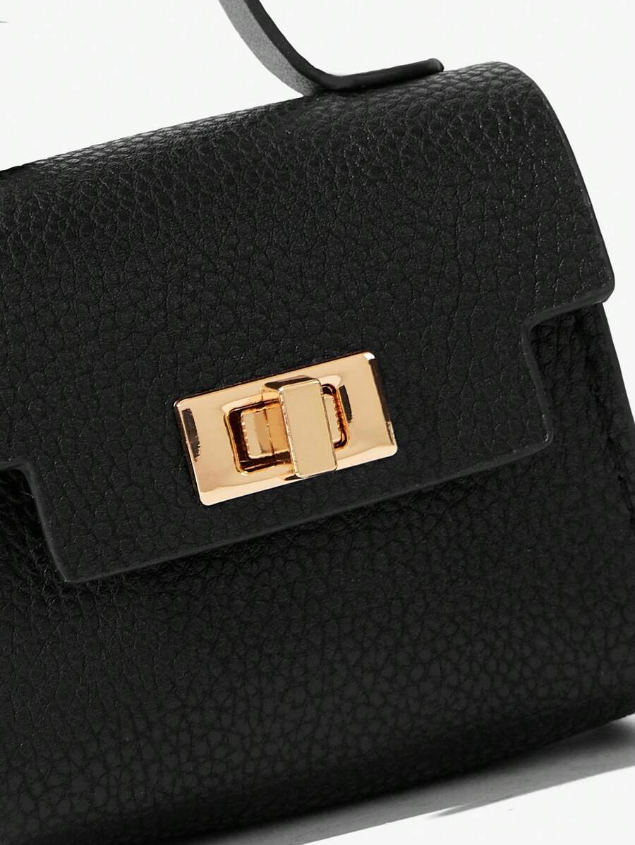 Close-up view of mini key ring holder keychain coin purse earphone pouch bag charm with chain strap, coin purse format, key ring detail for small-item storage