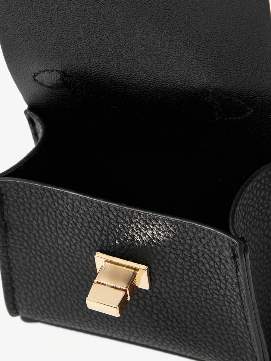 Close-up view of mini key ring holder keychain coin purse earphone pouch bag charm with chain strap, coin purse format, key ring detail for small-item storage