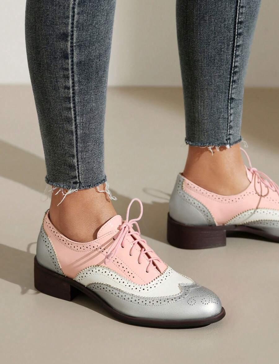 Step out in style with these Multicolor Women's Perforated Lace-Up Wingtip Oxfords. Crafted from vintage leather, their charming wingtip design and perforated details add a touch of retro flair. The comfortable flat sole makes them perfect for all-day adventures, while the vibrant colors bring a playful twist to a classic look. Mix vintage vibes with modern fun in these unique shoes!