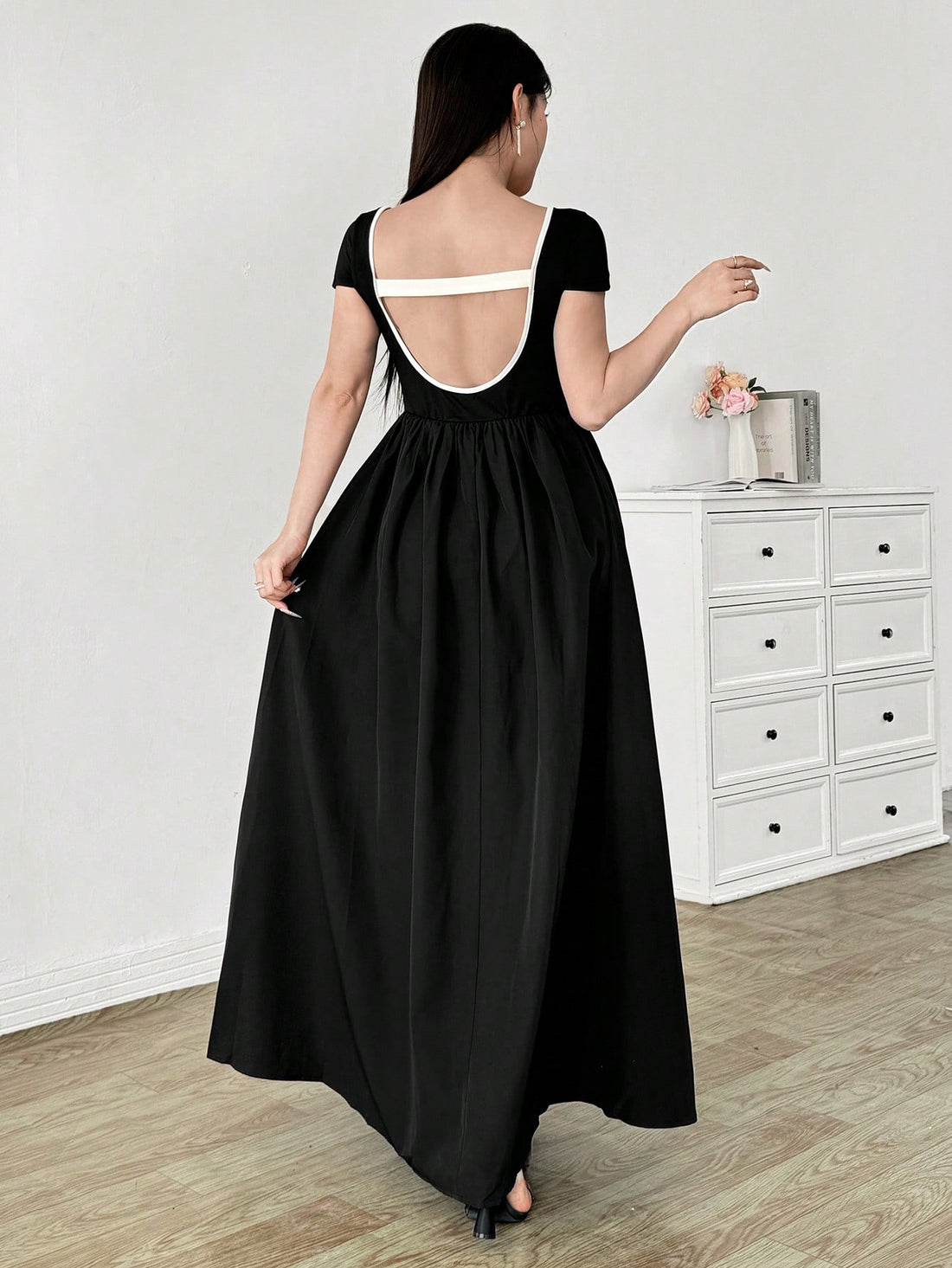 This playful midi dress features a charming contrast color patchwork design, flattering square neckline, and adorable bow detail. Perfect for any occasion, this dress will make you stand out with its stylish and unique look. So why settle for boring dresses when you can make a statement in this one?