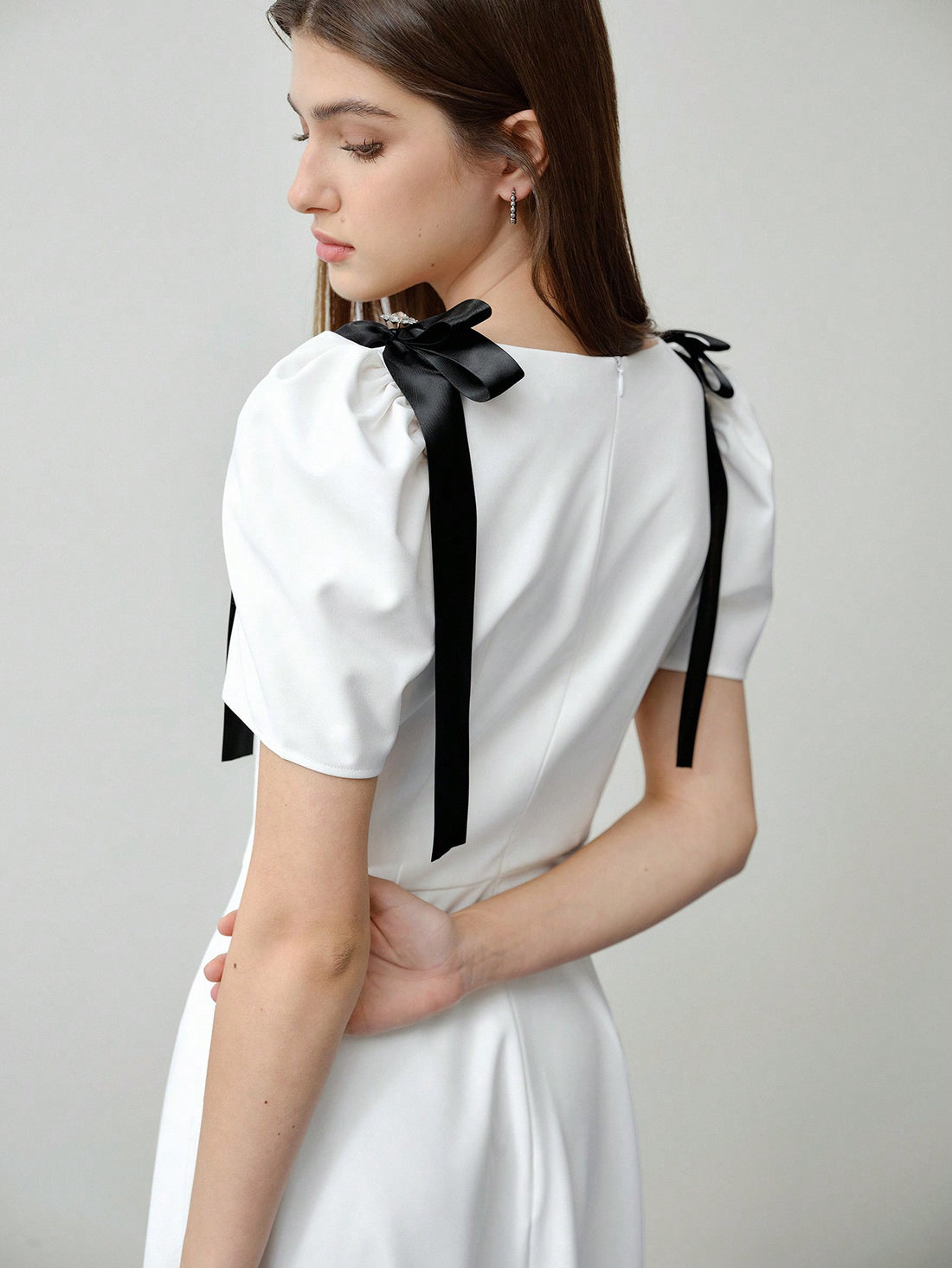 Step into spring with this playful puff sleeve dress, featuring a charming bow detail that adds a flirty touch perfect for Valentine's Day or sunny days ahead. Its light, breezy design keeps you comfortable while turning heads wherever you go. Embrace effortless style and a fun, feminine vibe all season long.