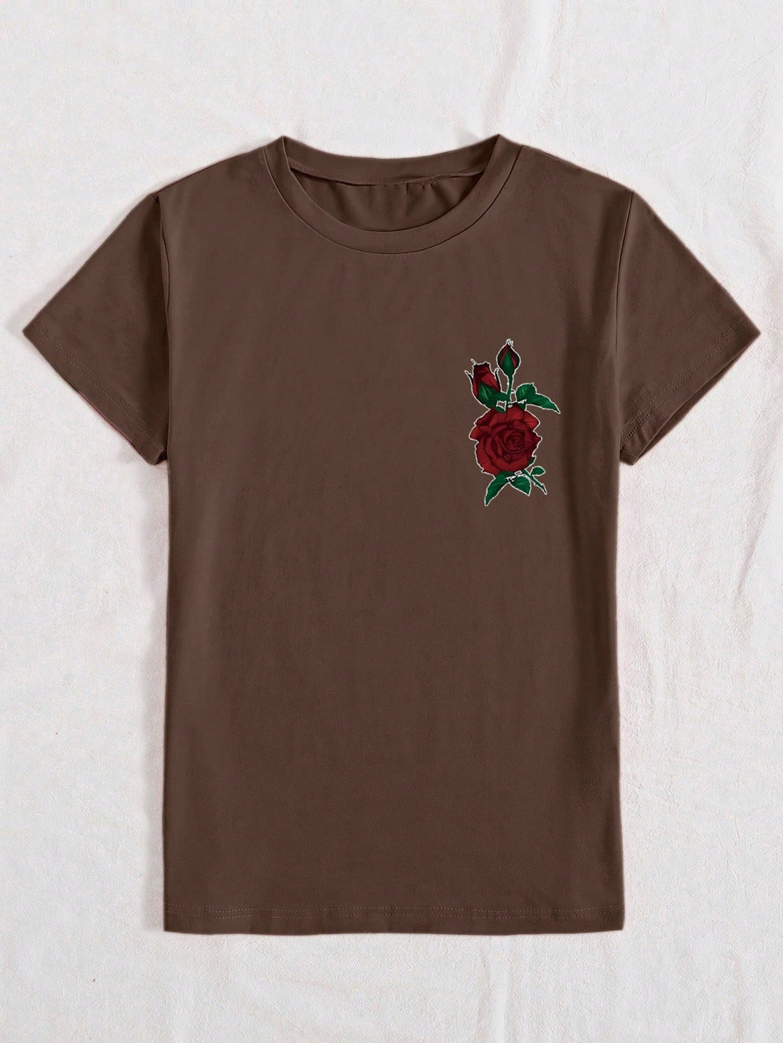 Add a touch of chic floral elegance to your wardrobe with this women's t-shirt featuring a beautiful rose letter print. Perfect for a casual day out, this t-shirt is both stylish and comfortable. Make a statement with fashion and comfort combined!