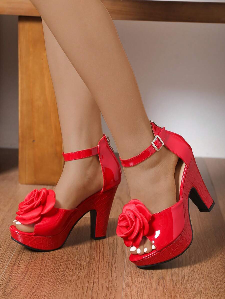 Step into confidence with these show-stopping patent leather platform sandals! Featuring a charming flower embellishment and peep-toe design, they're the perfect blend of bold and beautiful. The chunky heel provides all-day comfort and stability, while the waterproof patent finish keeps your feet fabulous rain or shine. Whether you're heading to brunch, a night out, or just turning heads around town, these statement sandals deliver serious style without compromising on practicality. Dress them up or down—th