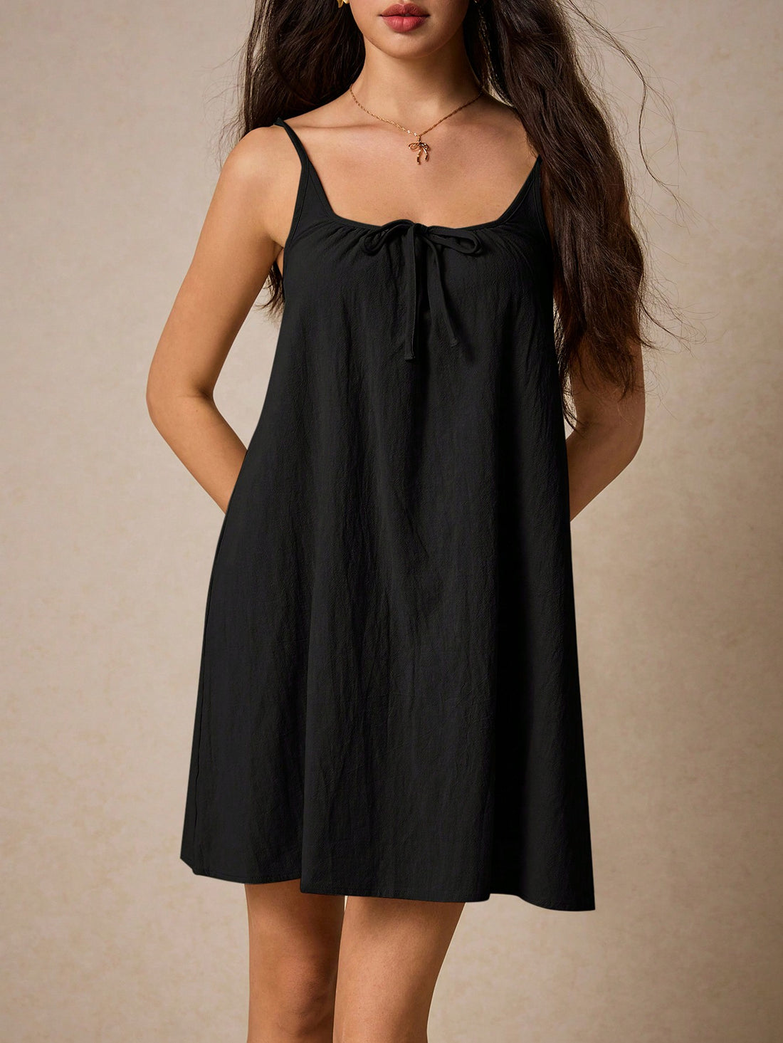 Look effortlessly stylish in our Chic & Casual dress! Featuring a flattering spaghetti strap design and a front tie, this solid color dress is perfect for any occasion. With its versatile look, you can dress it up or down, making it a must-have addition to your wardrobe.