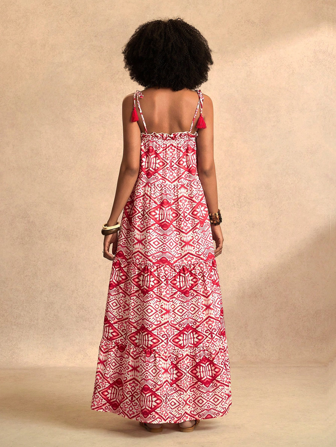 Embrace effortless beach style with our Chic Spring & Summer Maxi Dress. This stunning dress features tassel details and a vibrant floral print, perfect for the season. Enjoy a playful and carefree look while being on-trend. Who says you can't look effortlessly chic at the beach? (Hint: It's definitely not us!)