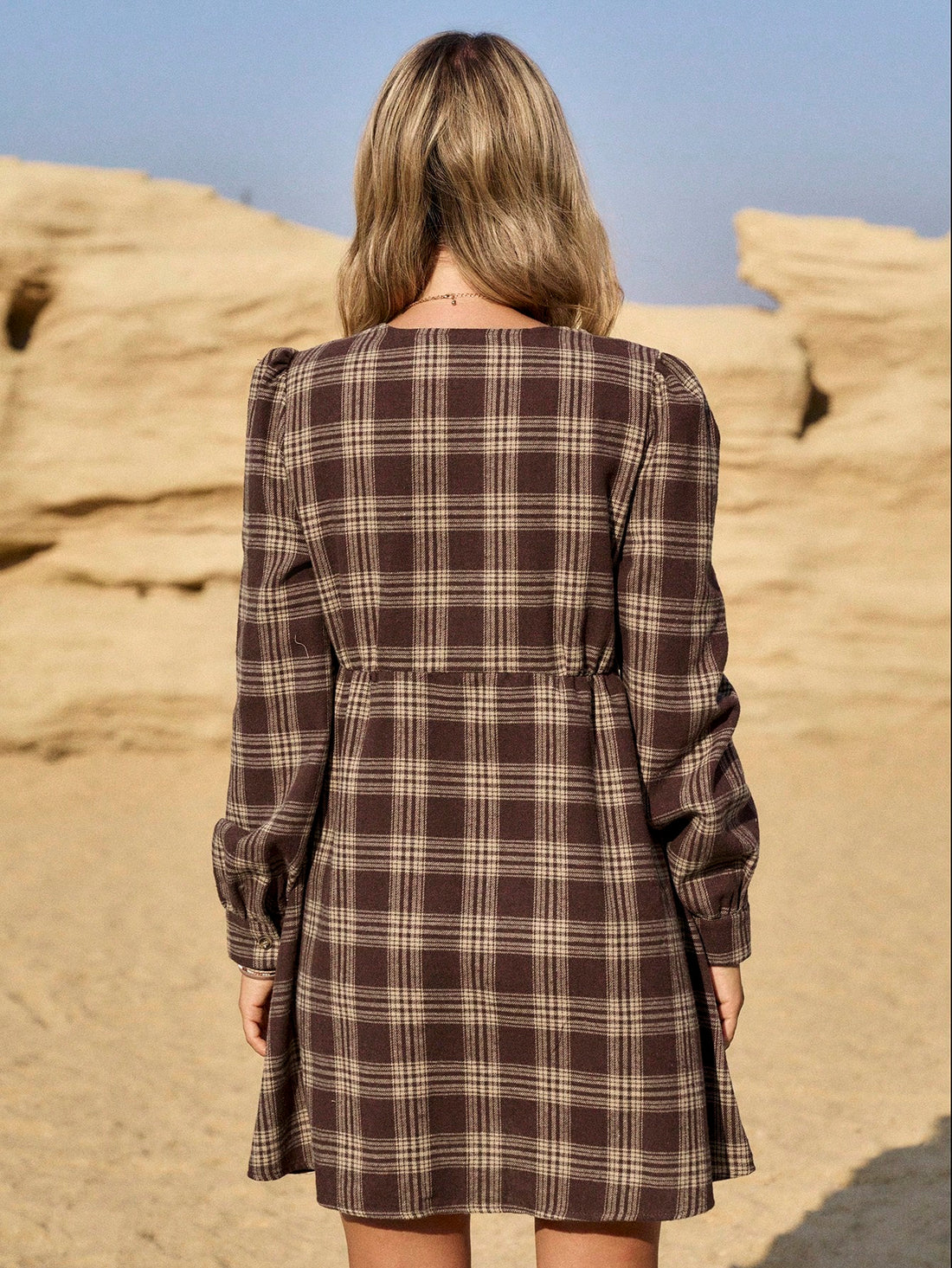 Be the statement at any event with this chic khaki plaid midi dress. The classic plaid print is elevated with modern details like a midi length and long sleeves. You'll be both stylish and comfortable in this fashion-forward dress.