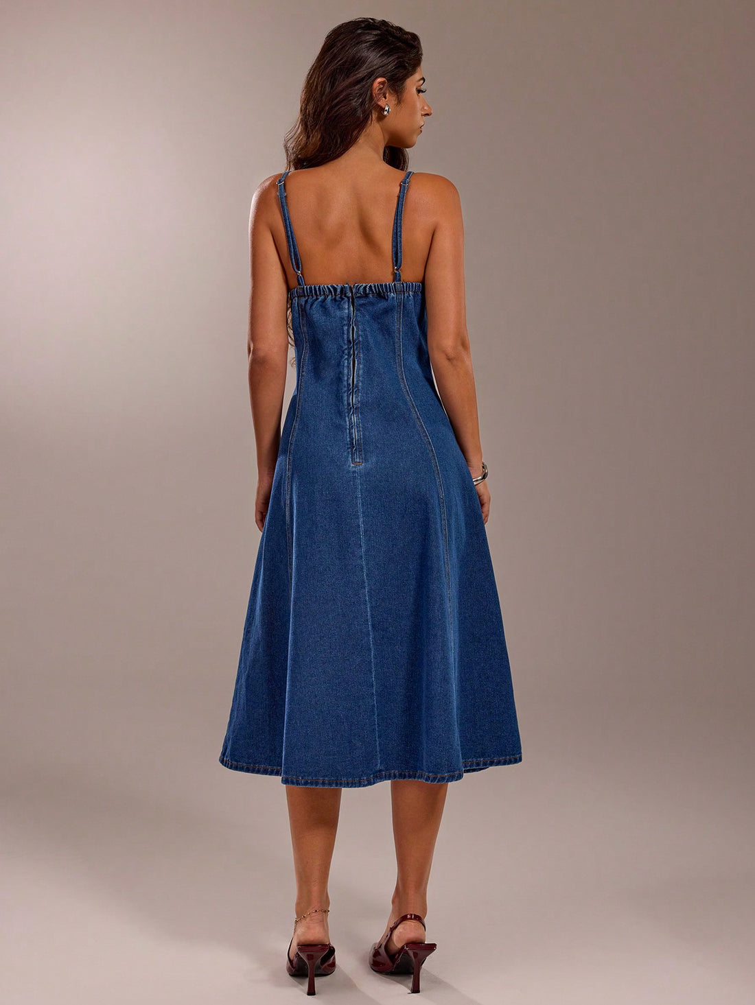 Elevate your style with our Timeless Denim Charm: Sleeveless Midi Dress. This effortlessly elegant dress exudes charm and sophistication, while providing the comfort of denim. Perfect for any occasion, it's a must-have addition to your wardrobe.