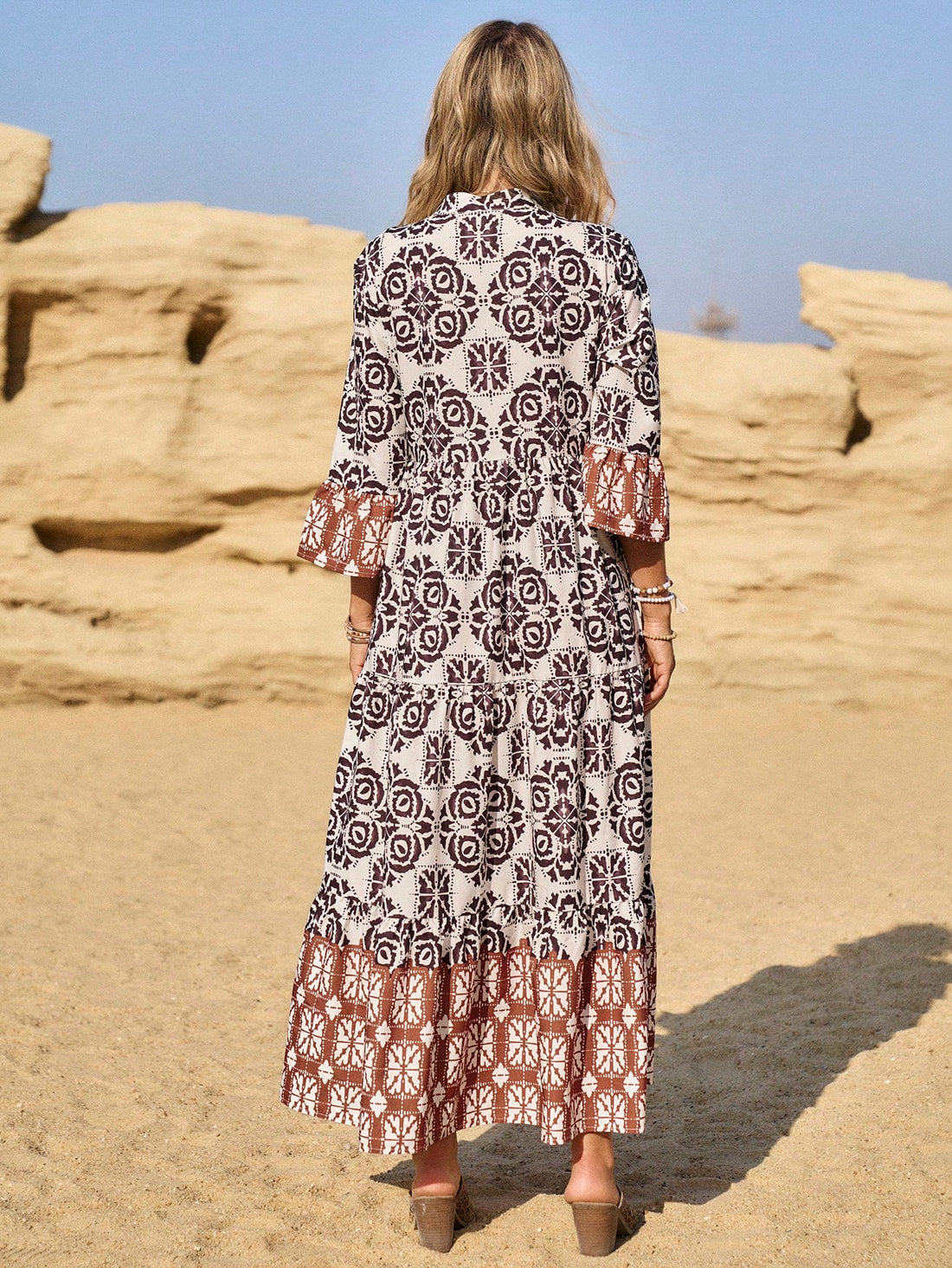Get ready to escape this summer in style with our Effortless Elegance Printed Flare Sleeve Midi Dress! Featuring a unique print and flattering flare sleeves, this dress will effortlessly elevate your summer wardrobe. Perfect for any casual occasion, it's the ultimate combination of elegance and ease.