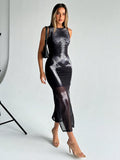 Front view of black sleeveless bodycon dress with gray skeleton print and sheer mesh hem