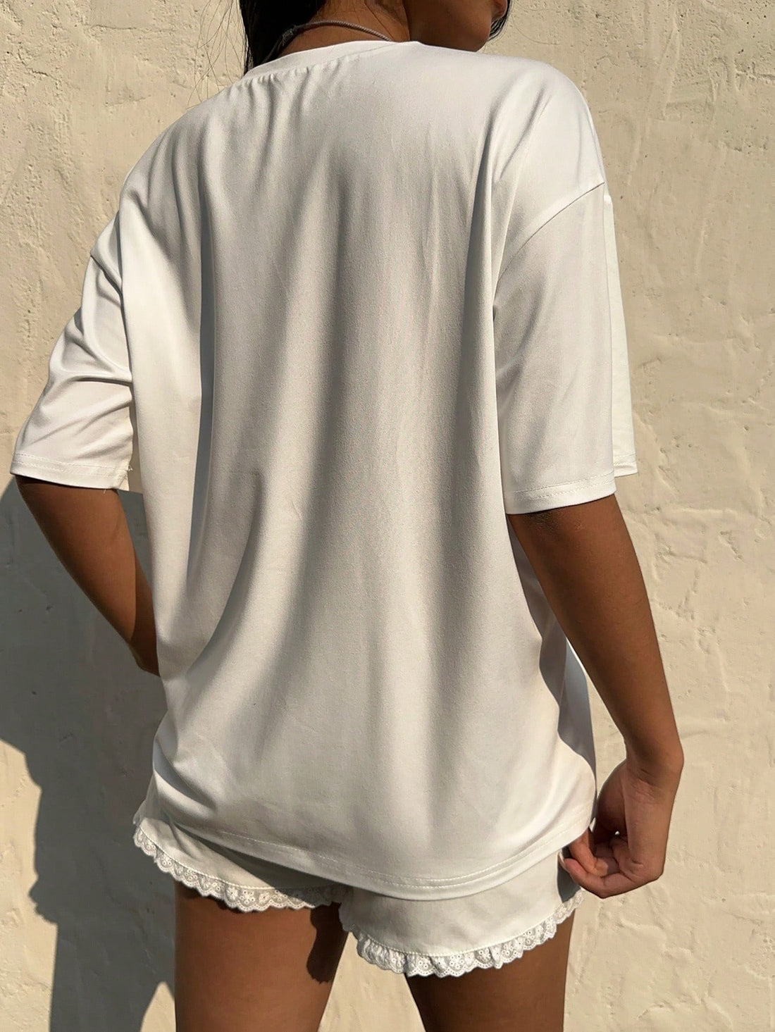 Get ready to rock an effortlessly cool look with our White Graphic Tee! Made with dropped shoulders and a quirky style, this tee brings a playful edge to any outfit. Perfect for those who don't take themselves too seriously, it's a must-have for adding some fun to your wardrobe!