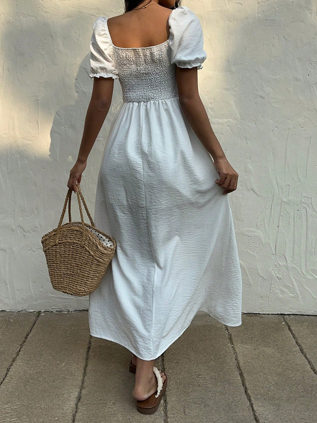 Elevate your style with our Effortless Elegance Dress. This pure white stunner features a deep v-neck, puff sleeves, and a sexy slit. Perfect for any occasion, it's the ultimate addition to your wardrobe. (Pure elegance made easy, ladies).