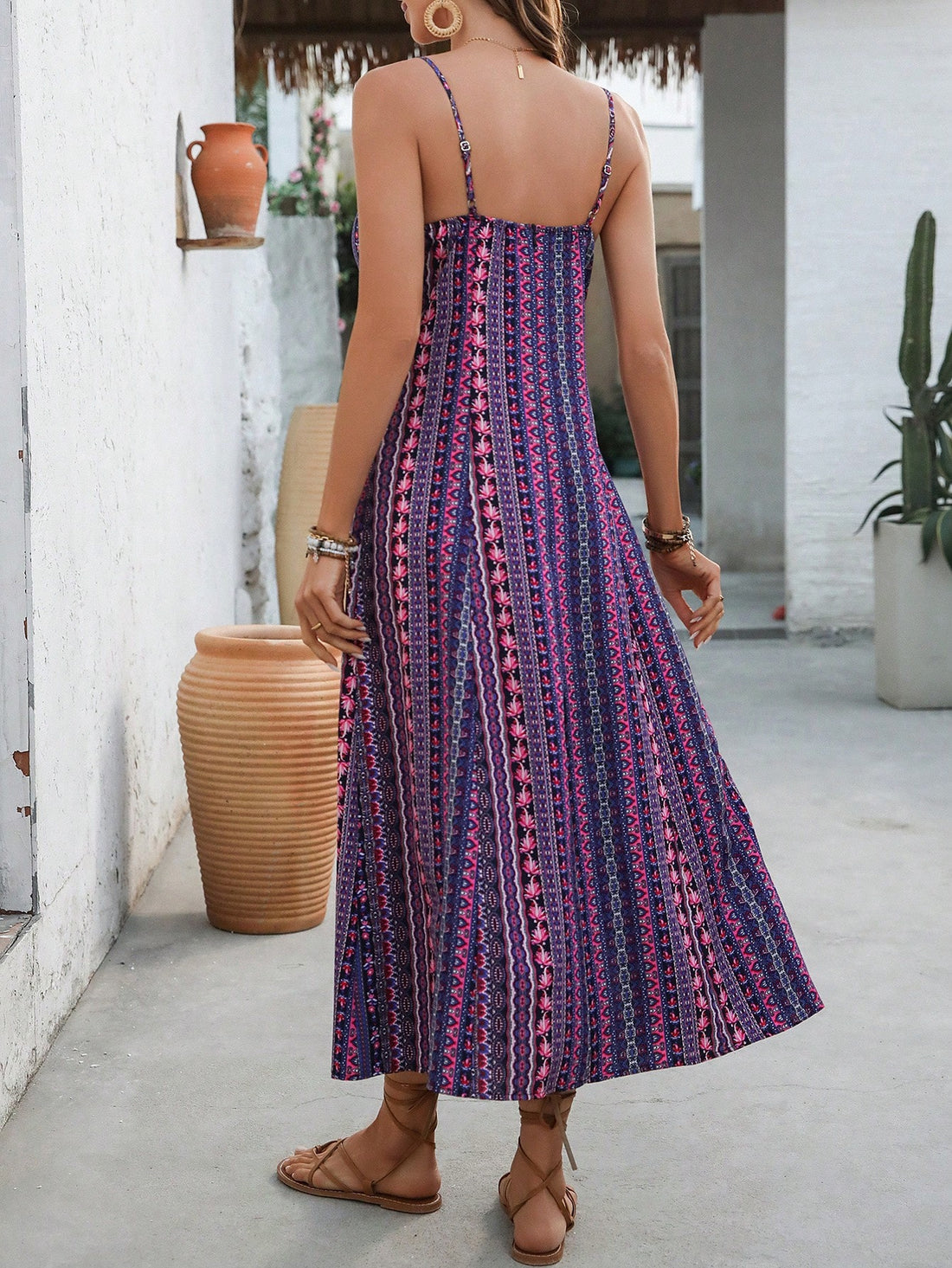 Step into effortless style with this chic vintage printed maxi dress. Featuring delicate spaghetti straps and a daring high side slit, it’s perfect for beach vacations or sunny strolls. The playful print and flowing silhouette keep you cool and confident, making every moment feel like a getaway.