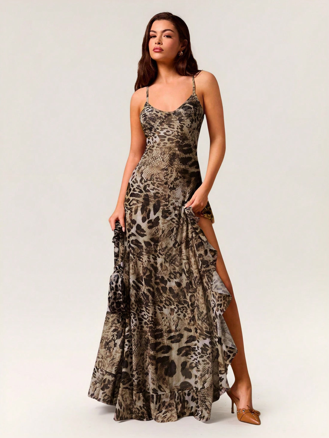 Make a statement in this jungle camo maxi dress that blends wild prints with modern edge. The thigh-high slit keeps things flirty while the delicate ruffle detail adds unexpected charm—perfect for turning heads at any occasion. Whether you're dressing up for a night out or keeping it casual, this piece proves that bold patterns and feminine touches are the ultimate power combo. Embrace your adventurous side and own the room!