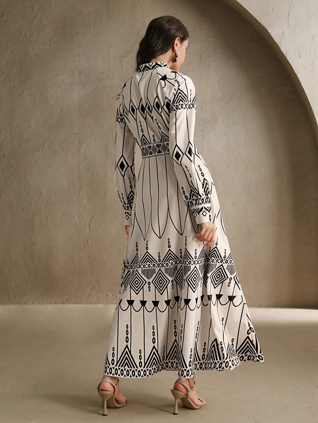 Add a playful and unique touch to your spring wardrobe with our Chic Geometry dress. Featuring a stand collar and lantern sleeves, this dress is perfect for both spring festivals and elegant vacations. Its geometric design adds an extra level of style, making you stand out from the crowd.