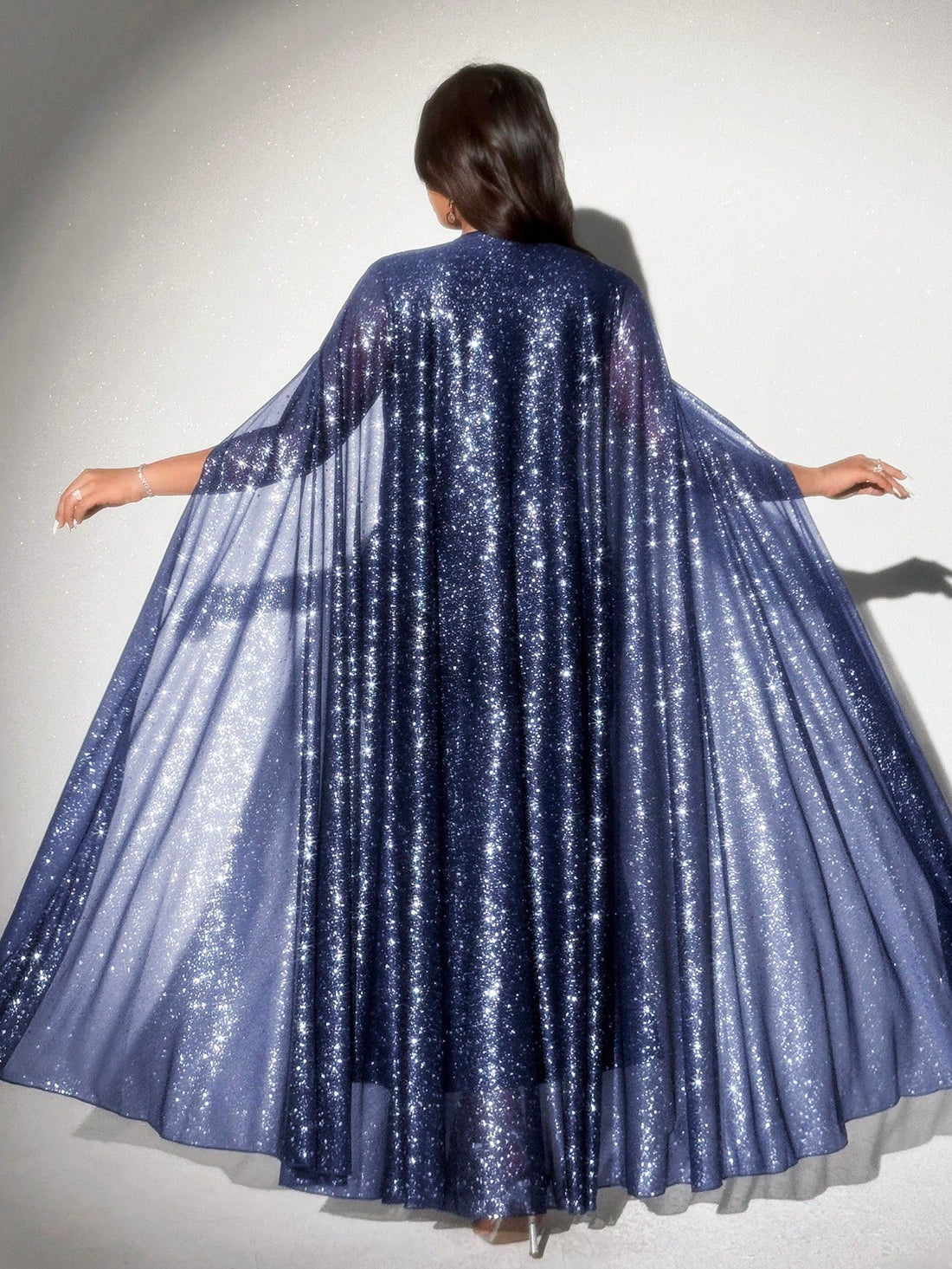 Turn heads at any event with this Elegant Plus Size Foil Print Fish Tail Dress. Its shimmering foil print and flattering fishtail silhouette bring a touch of luxury and fun to your party wardrobe. Designed to celebrate curves, this dress combines comfort with standout style for unforgettable nights.