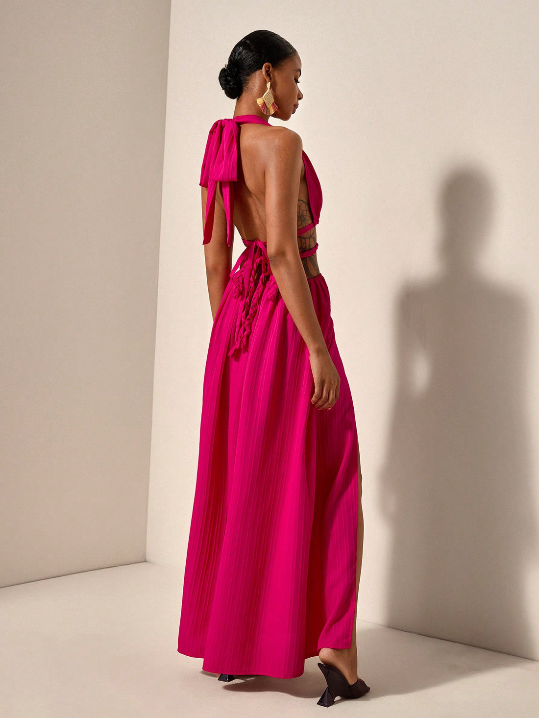 Get ready to turn heads in this chic and playful halter neck maxi dress! With a stunning backless design and high slits, this dress is perfect for any spring or summer holiday. Stand out from the crowd and embrace your unique style with this must-have dress!