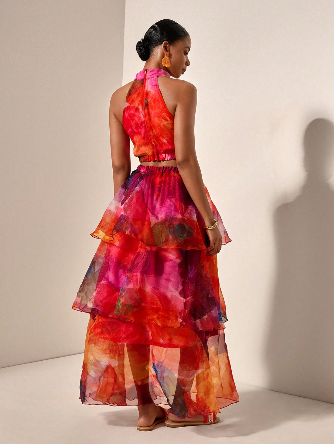 Spread the love this Valentine's Day in this show-stopping tie-dye set! The halter top features a flattering neckline and vibrant color-blocked design, while the ruffled skirt adds playful movement and dimension. Perfect for date night, galentine's celebrations, or whenever you want to turn heads. Mix bold patterns with confidence and let your personality shine through. Whether you're dancing the night away or grabbing coffee with your crew, this trendy two-piece combo keeps you looking effortlessly chic an