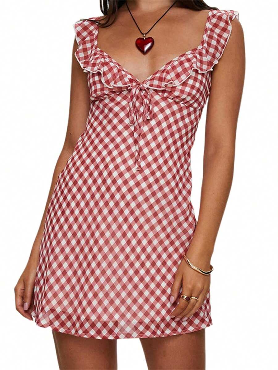 Unleash your playful side in this plaid mini dress! With its ruffled details and tie-up front, you'll be sure to turn heads. The sleeveless V-neck design is perfect for summer fashion, making it an essential addition to your wardrobe. Stand out from the crowd with this unique and stylish dress.