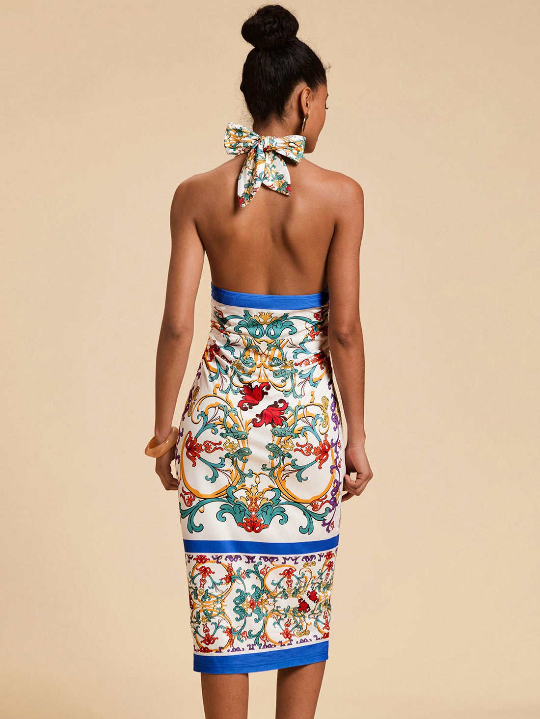 Make a statement with this eye-catching Baroque print halter dress! The knitted fabric hugs your curves in all the right places while the playful pattern turns heads wherever you go. Perfect for summer soirées, beach vacations, or adding a splash of personality to your everyday wardrobe. Pair with strappy sandals for a complete look that screams confidence!