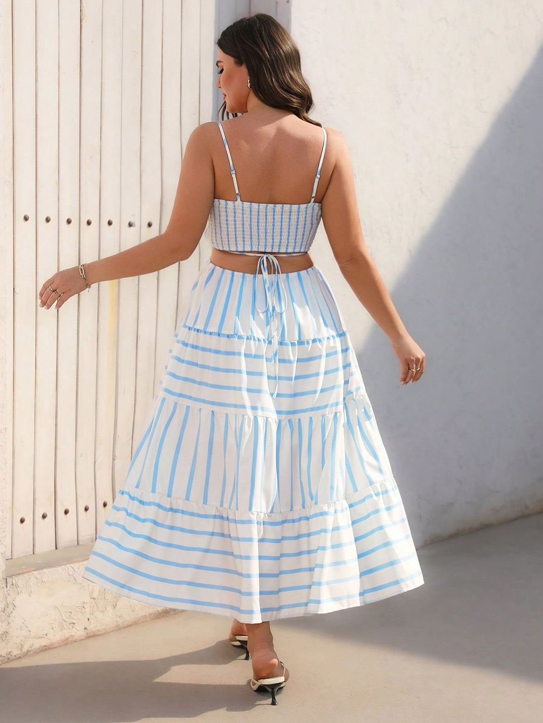 Step into summer with this playful plus size vintage striped cami dress, designed for effortless elegance on your vacation. The hollow-out details add a flirty touch while keeping you cool, and the classic stripes bring timeless charm. Perfect for sunny days and breezy evenings, this dress combines comfort and style for your most memorable getaway moments.