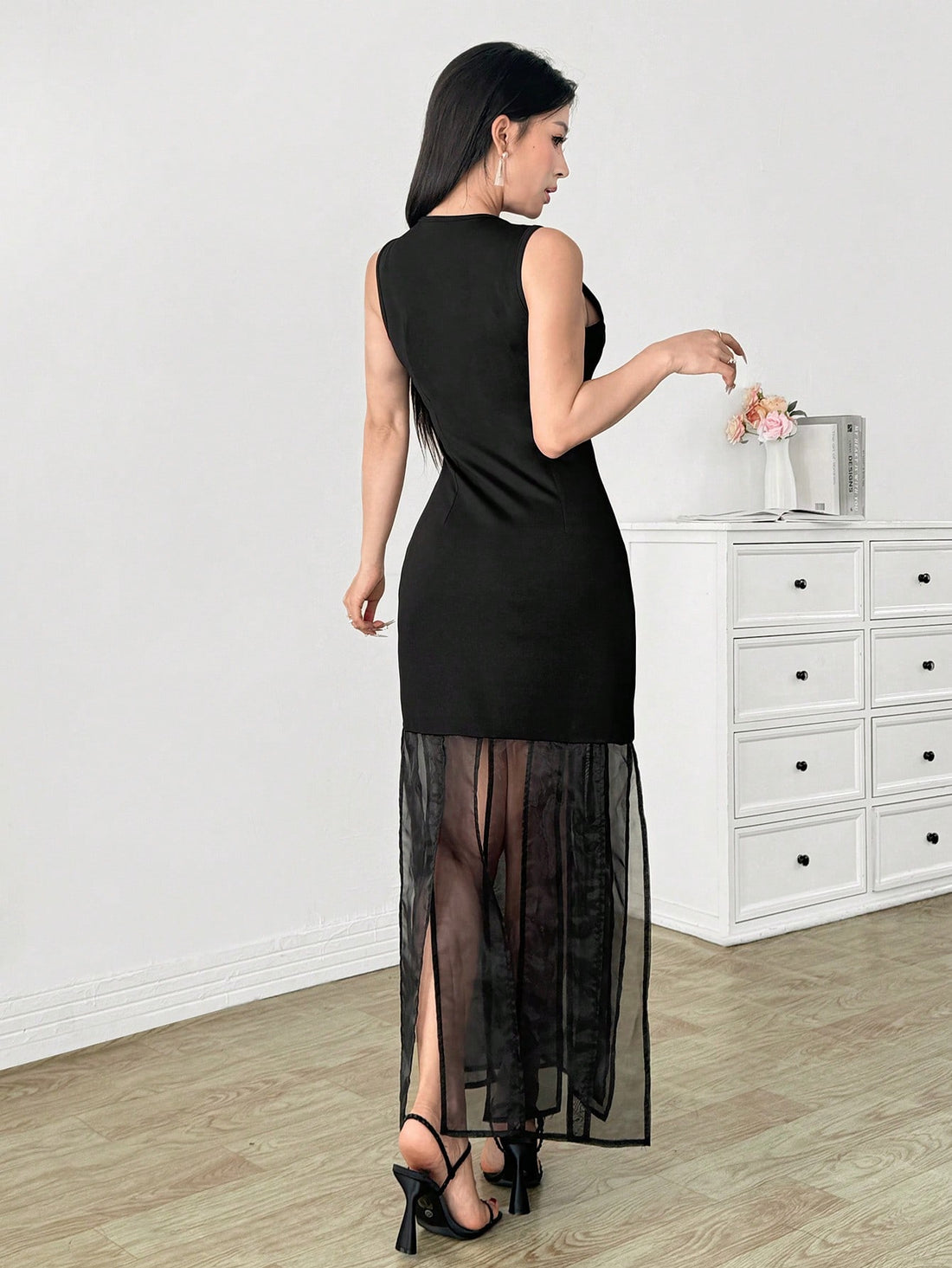 Add some sophistication and sexiness to your wardrobe with our Elegant Sexy Black Dress! The crew neck and sleeveless design offer a modern touch, while the patchwork details bring a unique charm. Perfect for a night out or special occasion, this dress is sure to turn heads.