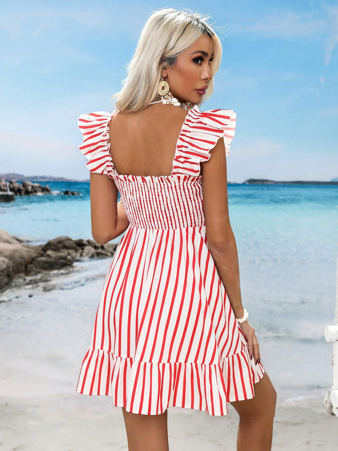 This dress is perfect for your next vacation (or just pretending you're on one)! Its chic striped print and playful ruffle-trim add a touch of whimsy to your style. And with its airplane print design, you'll always be ready for takeoff. Bon voyage, fashionistas!