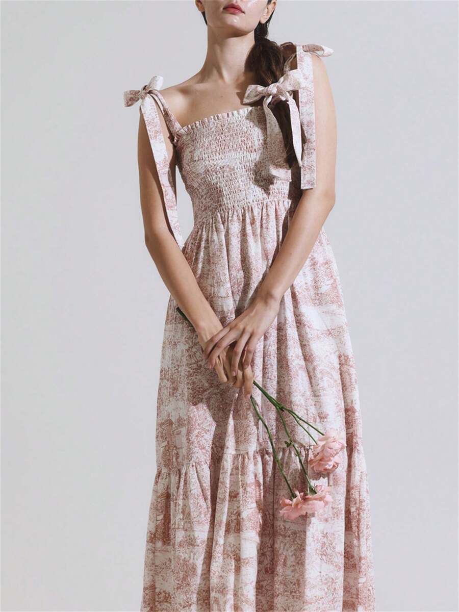 Introducing our Chic Summer Vintage Print A-Line Dress, featuring a flattering A-line silhouette and playful tie shoulder detailing. The smocked bust adds a touch of vintage charm to this versatile and stylish dress. Perfect for any summer occasion. (Get ready to turn heads!)