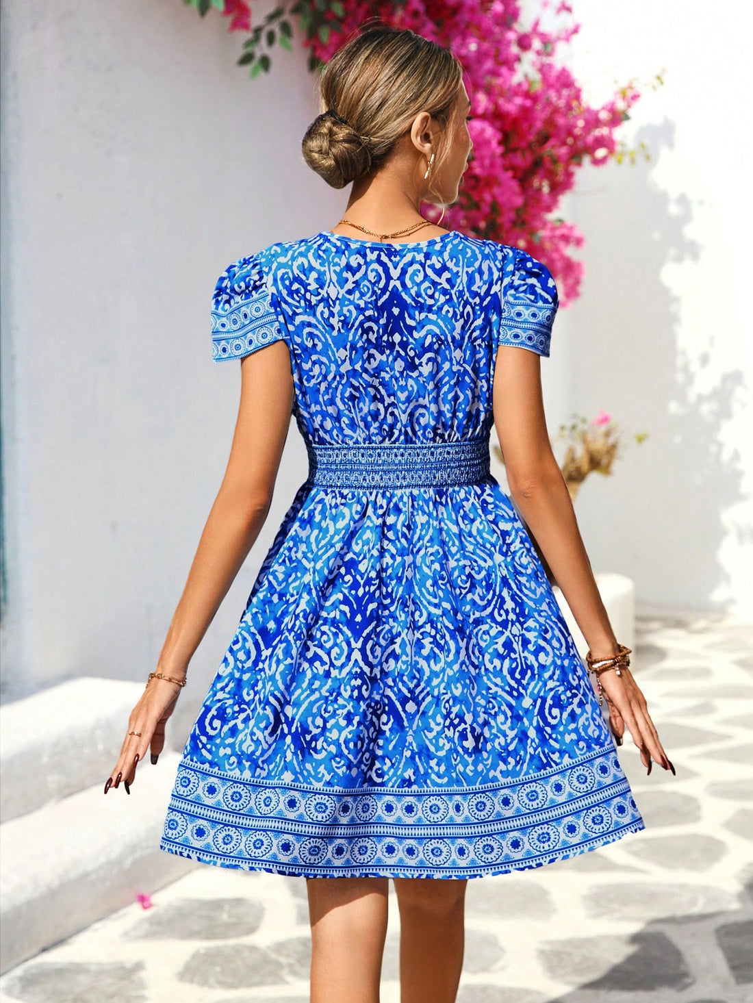 Step into vacation mode with this chic women's dress featuring a playful deep V-neck and charming puff sleeves. Its vibrant print adds a fun flair, making it perfect for casual outings or beachside strolls. Lightweight and breezy, it keeps you comfortable while turning heads wherever you go.