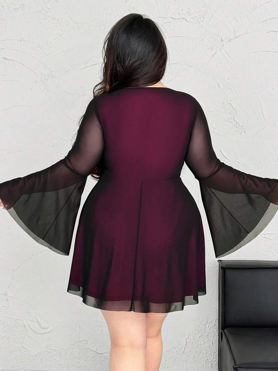 Step out in style with this playful plus size A-line dress featuring a flattering V-neck and eye-catching contrast colors. The heart-shaped bell sleeves add a fun, flirty touch, making it perfect for any occasion where you want to feel confident and charming. Comfortable and chic, this dress celebrates your curves with a lively twist.