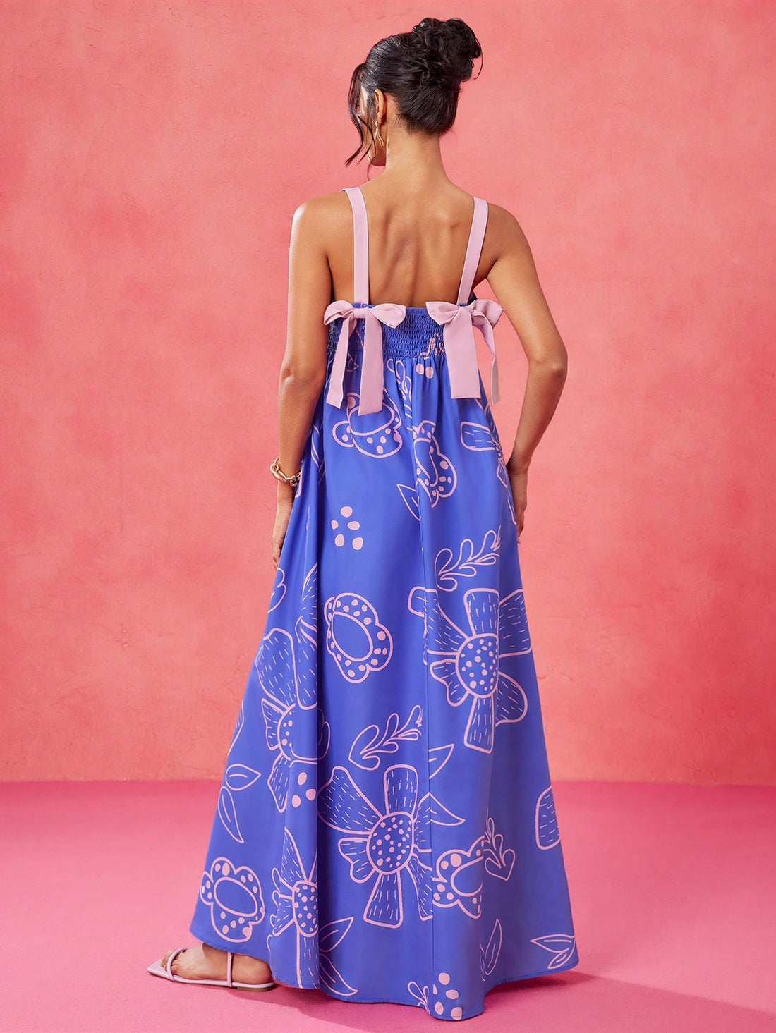 Effortlessly embody summer style with our Floral Elegance maxi dress! This designer piece features a beautiful blue and pink floral pattern that adds a touch of elegance to any look. Perfect for any occasion, this dress will make you stand out with its effortless beauty.
