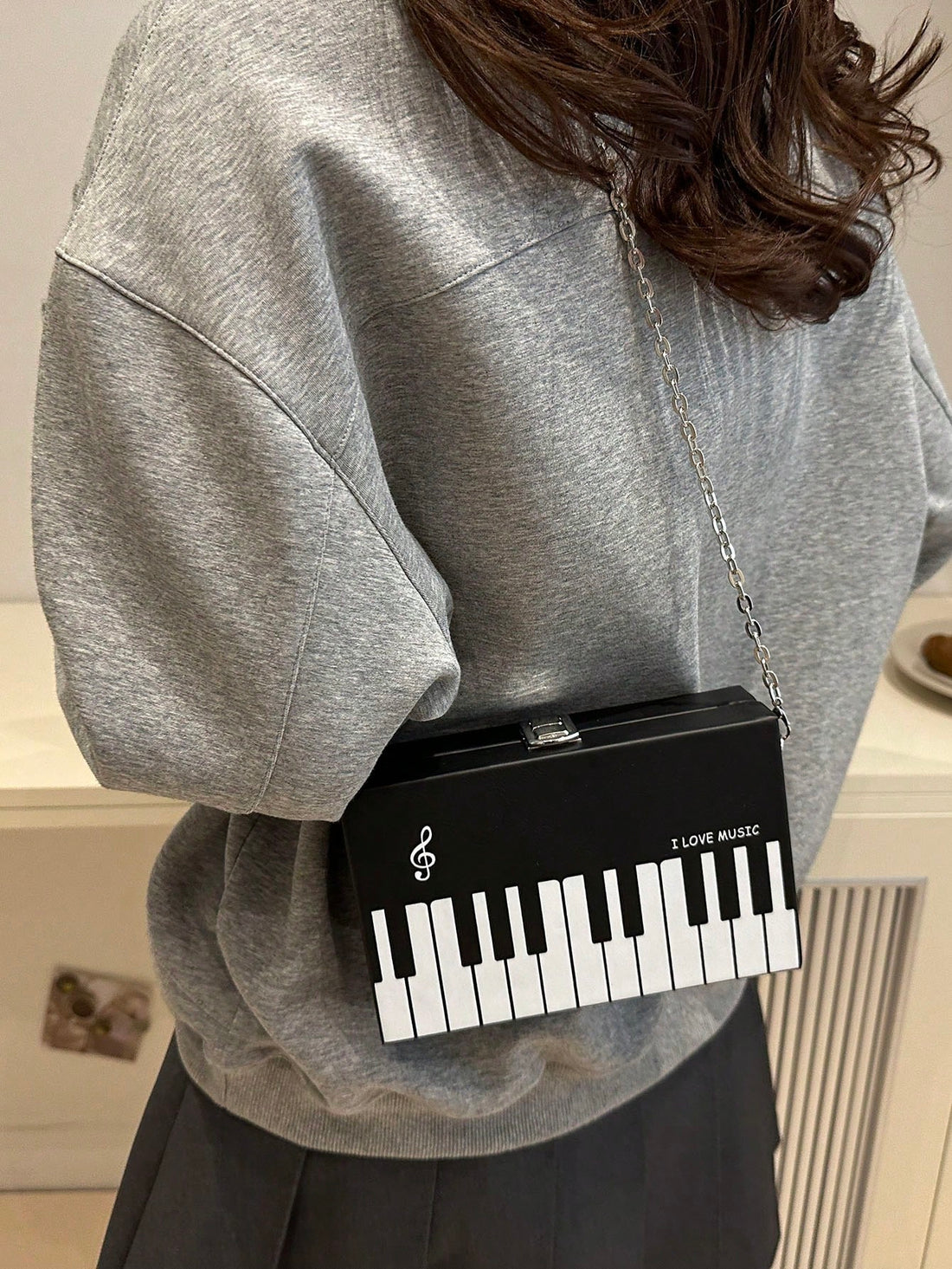 Add a touch of rhythm to your outfit with this Stylish Piano Print Mini Crossbody Bag. Compact yet spacious enough for your essentials, it features a playful piano key design that’s perfect for music lovers and partygoers alike. Lightweight and easy to carry, it’s your go-to accessory to keep your hands free and your style sharp, whether you're hitting a concert or dancing the night away.
