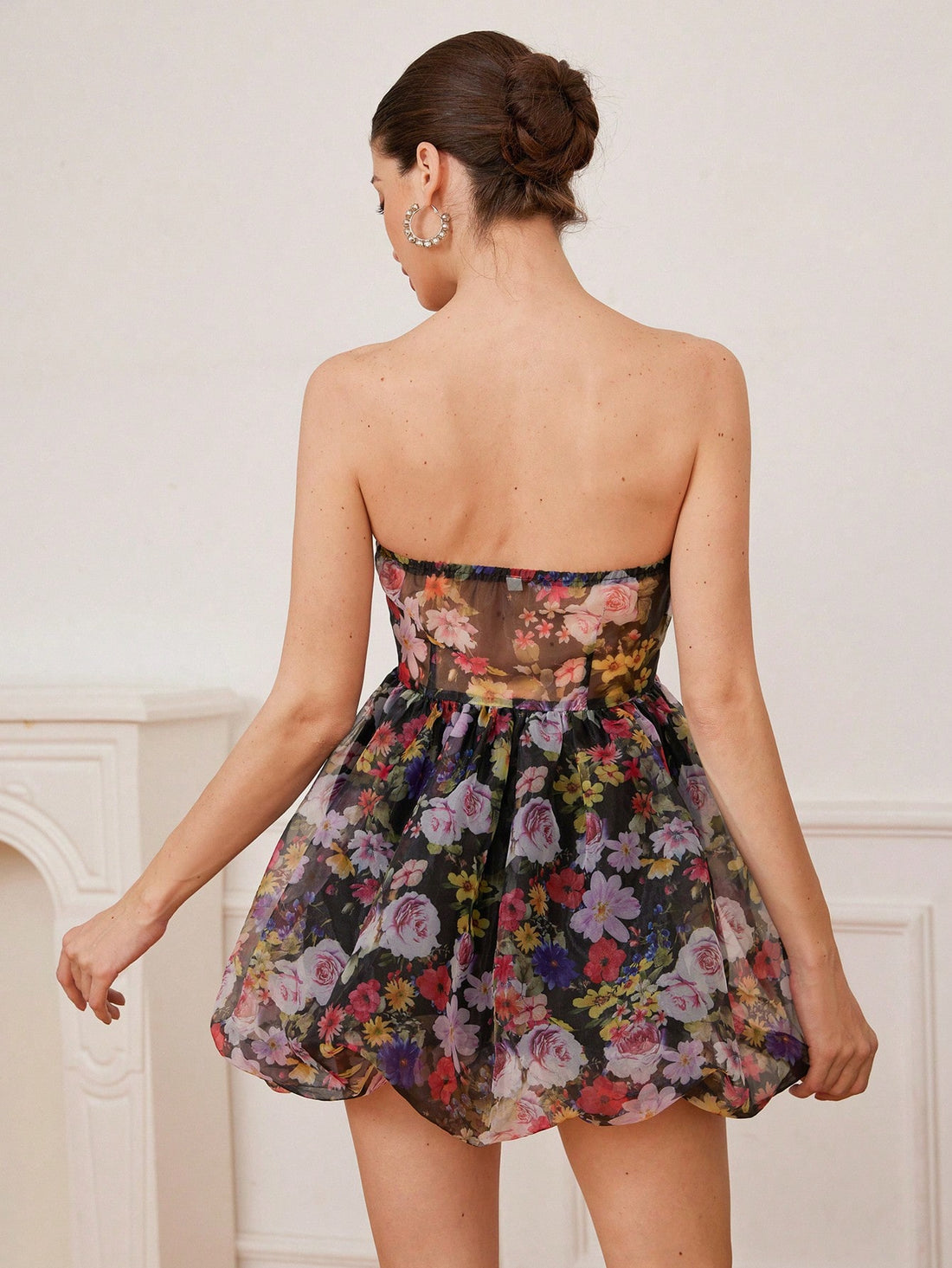 Get ready to turn heads in this playful Vintage Style Mini Dress! With its elegant strapless design and waist-cinched silhouette, it's the perfect combination of sophistication and fun. The delicate floral organza fabric and ruffle details add a touch of whimsy to this chic dress. Your new go-to for any special occasion!