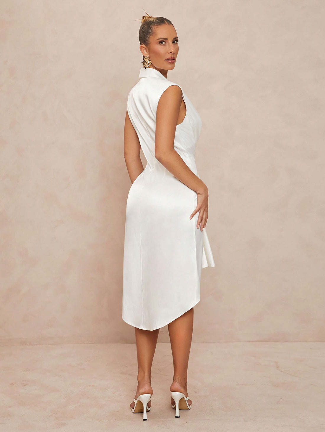 Turn heads this season with our Elegant Deep V-Neck Asymmetrical Bodycon Midi Dress. Perfect for spring weddings or summer getaways, its flattering silhouette and unique asymmetrical hem add a dash of fun sophistication. Lightweight and effortlessly chic, this dress keeps you comfortable and stylish from the ceremony to the sunset party.