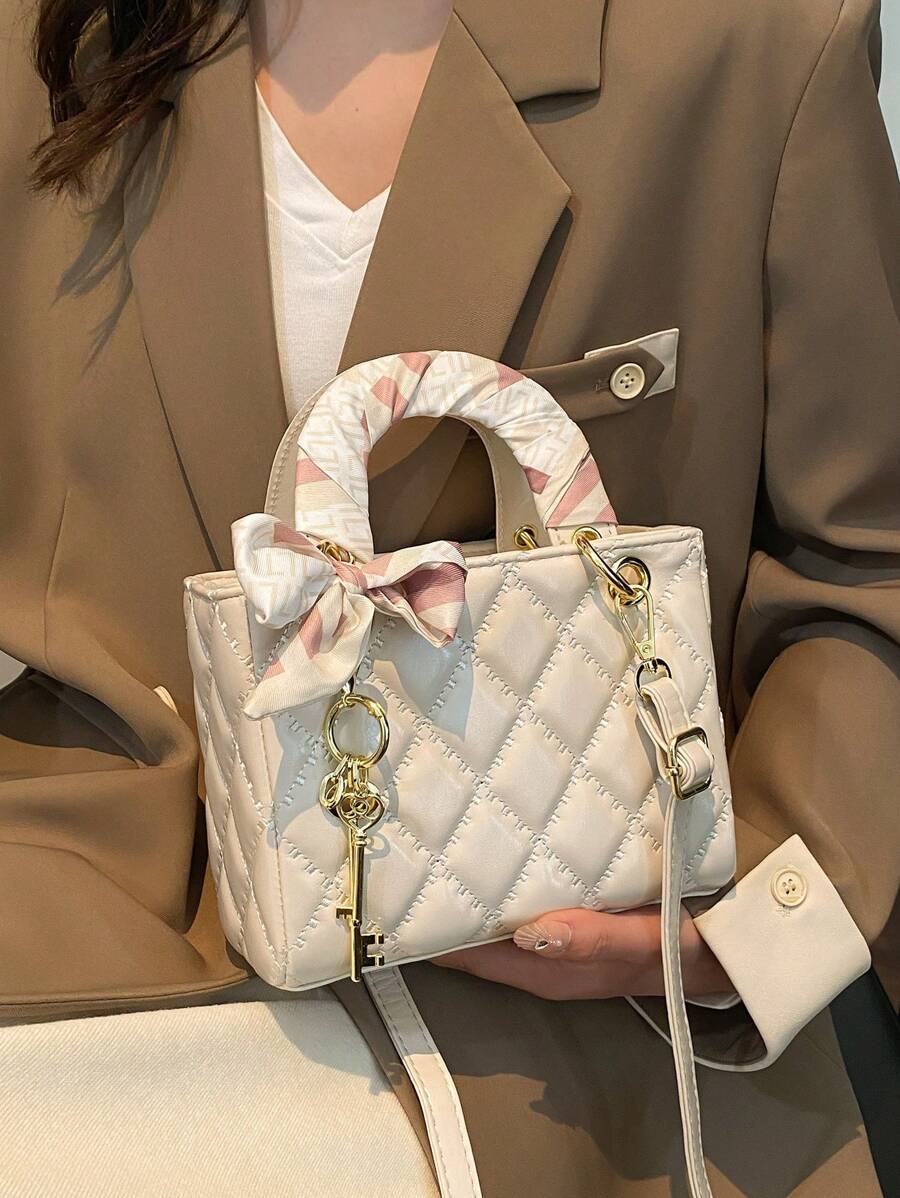 Elevate your everyday style with this chic quilted PU handbag that seamlessly transitions from boardroom to brunch. The sophisticated quilted texture paired with a delicate pendant charm adds just the right touch of personality to any outfit. Designed as a crossbody bag, it keeps your hands free while you conquer your day—whether you're juggling work meetings or weekend adventures. The versatile silhouette works with virtually any wardrobe, making it the ultimate go-anywhere companion. Looking for the perfe