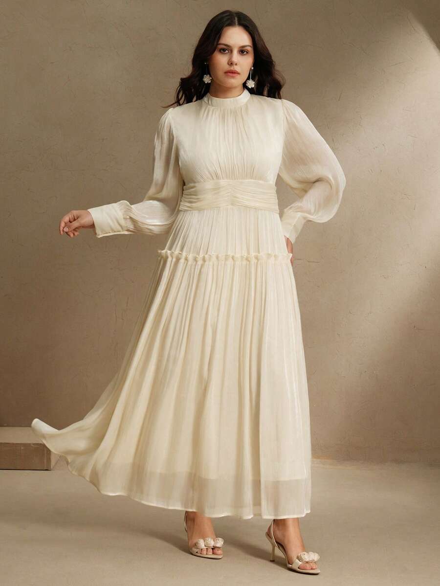 Step into elegance with this chic plus size long sleeve formal dress, designed to flatter every curve. The ruched waist adds a touch of sophistication while enhancing your silhouette, and the playful puff sleeves bring a fun, fashionable twist. Perfect for any special occasion, this dress combines comfort and style effortlessly, making you feel confident and fabulous all night long.