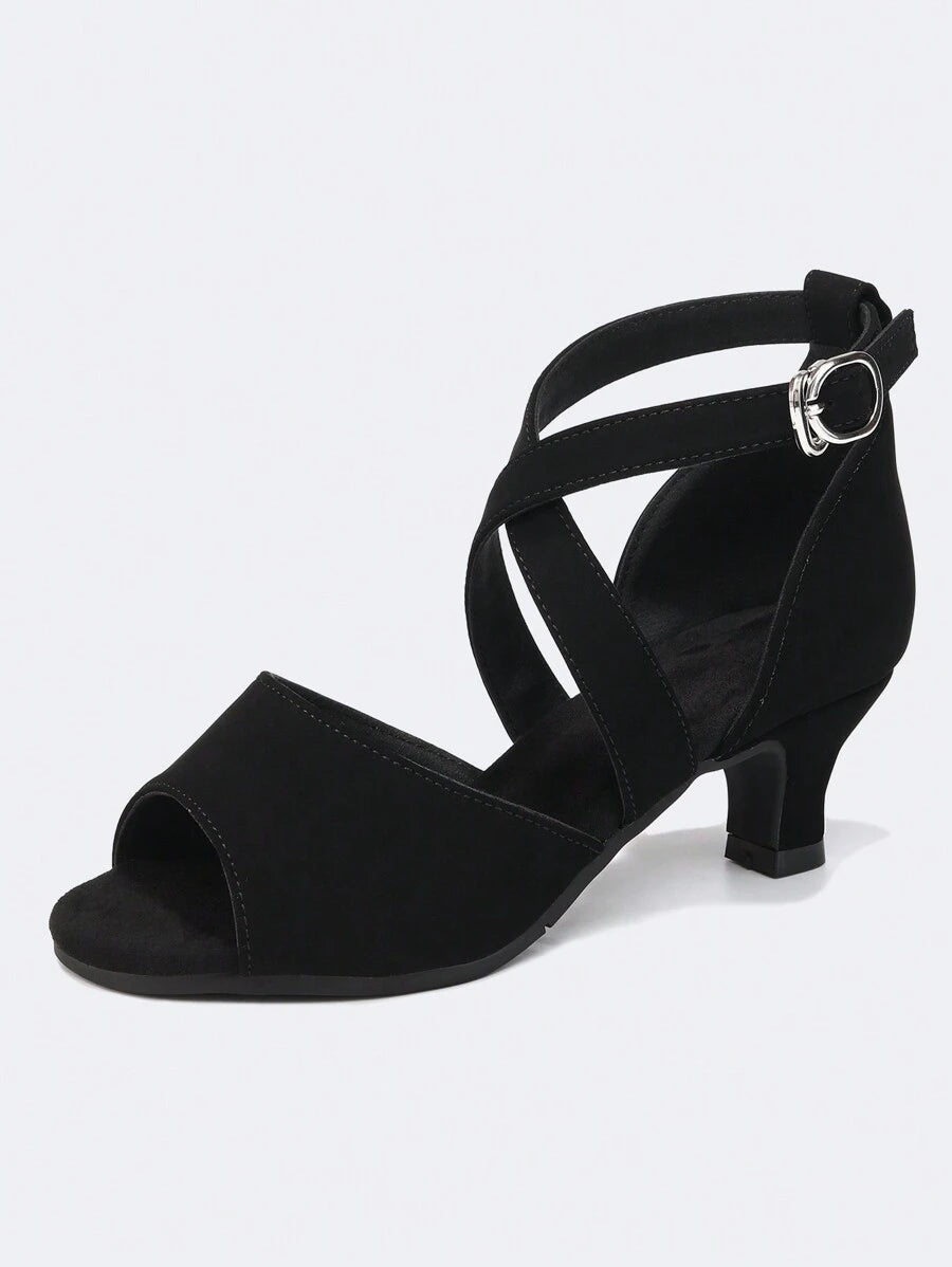 Elevate your dance floor presence with these stunning black Latin dance shoes, engineered for salsa, ballroom, and party settings. Featuring a fabric upper paired with a suedette insole for comfort and support, these women's shoes deliver the flexibility and grip needed for dynamic footwork. The durable rubber outsole ensures reliable traction whether you're dancing indoors or outdoors, while the secure buckle closure keeps your feet locked in place through every spin and step. Designed for both performance