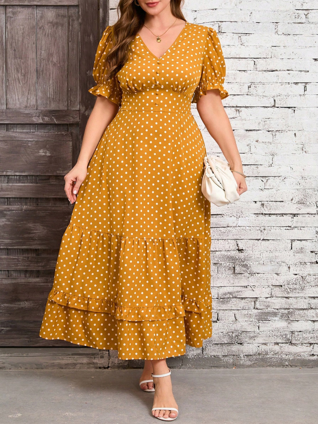 Get ready to turn heads in this chic yellow polka dot plus size maxi dress! The ruffle hem adds a touch of romance, making it perfect for vacations or elegant outings. With its flattering fit and playful print, this dress is sure to make you stand out in the best way possible.