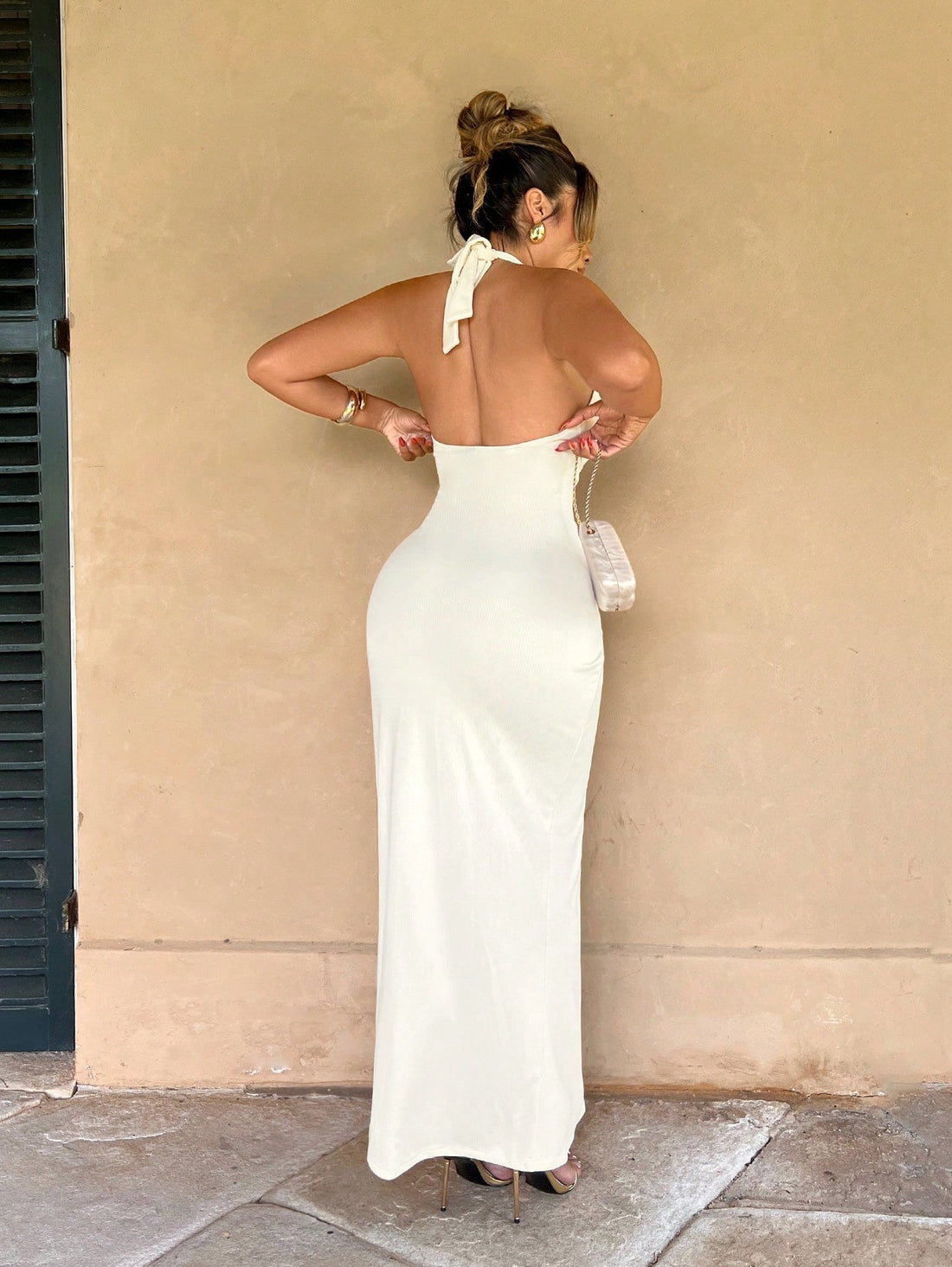 Turn heads in this stunning deep V-neck dress that's equal parts sophisticated and flirty. The ruched detailing hugs your curves beautifully while the button accents add a touch of unexpected charm. That daring high slit? It's your secret weapon for showing off those legs with confidence. Whether you're heading to a cocktail party, date night, or anywhere in between, this dress transforms any moment into something memorable. Dress it up with heels and statement jewelry, or keep it casual—either way, you'll 