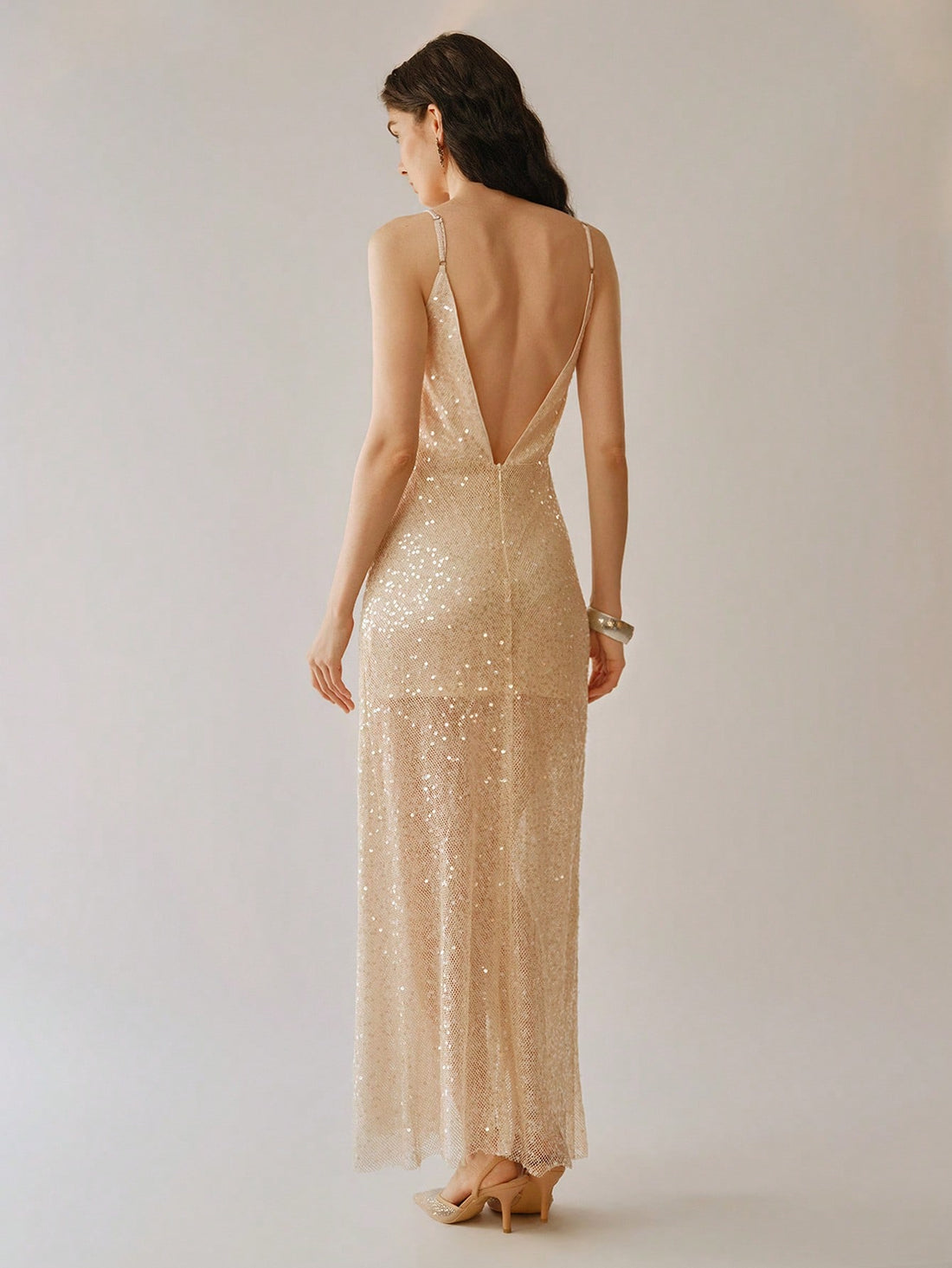 Unleash your inner diva with our Elegant Deep V-Neck Sequin Cami Backless Dress. Sparkle and shine in this stunning ensemble, featuring a sultry v-neckline, eye-catching sequins, and a seductive split hem. Perfect for a night out on the town or a special occasion. Get ready to turn heads!