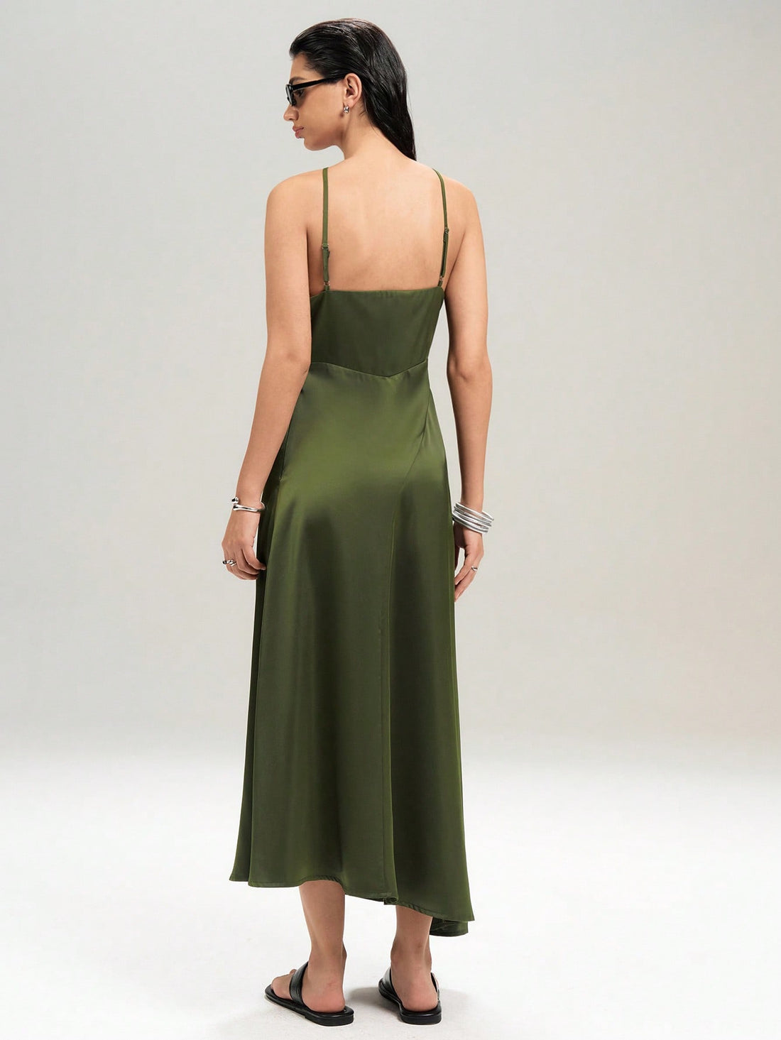 Turn heads this summer with this playful, elegant long dress featuring a backless halter neck and a flirty asymmetrical hem. Perfect for warm evenings, its flowing silhouette keeps you cool while adding a touch of chic sophistication to your look. Whether you're dancing under the stars or enjoying a sunset stroll, this dress brings effortless style and fun to every moment.