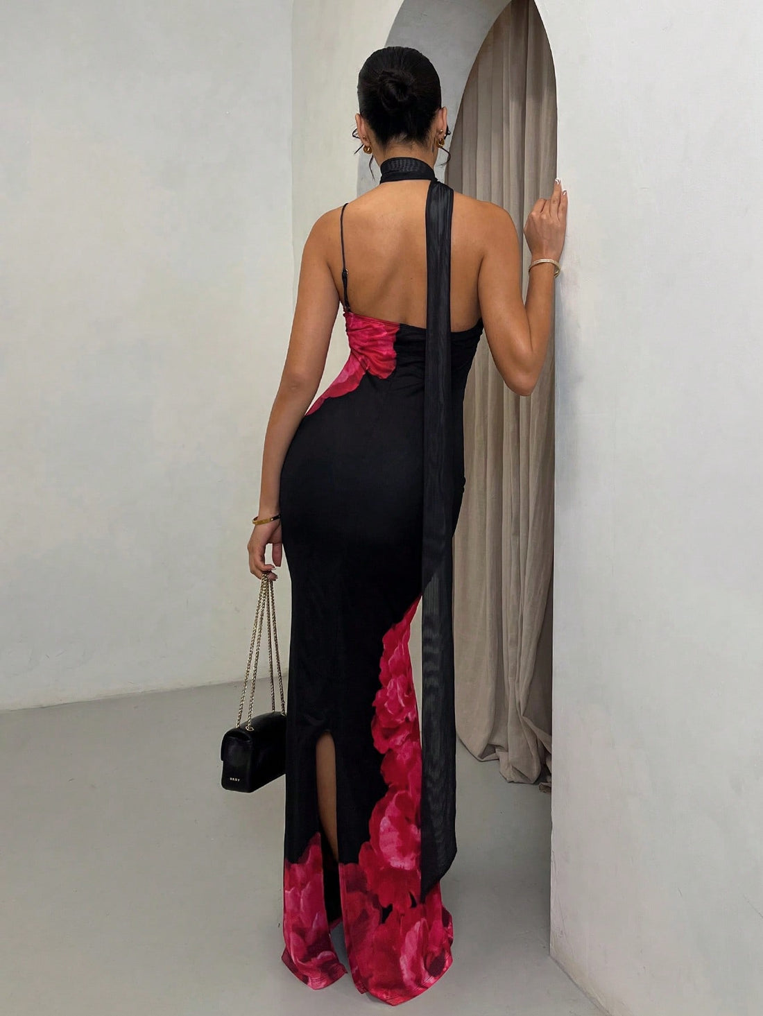 Featuring an elegant floral design, this maxi dress is the perfect choice for any spring or summer occasion. With its lightweight fabric and flattering fit, you'll feel comfortable and stylish all day long. Pair it with your favorite sandals for an effortless beach resort wedding outfit.